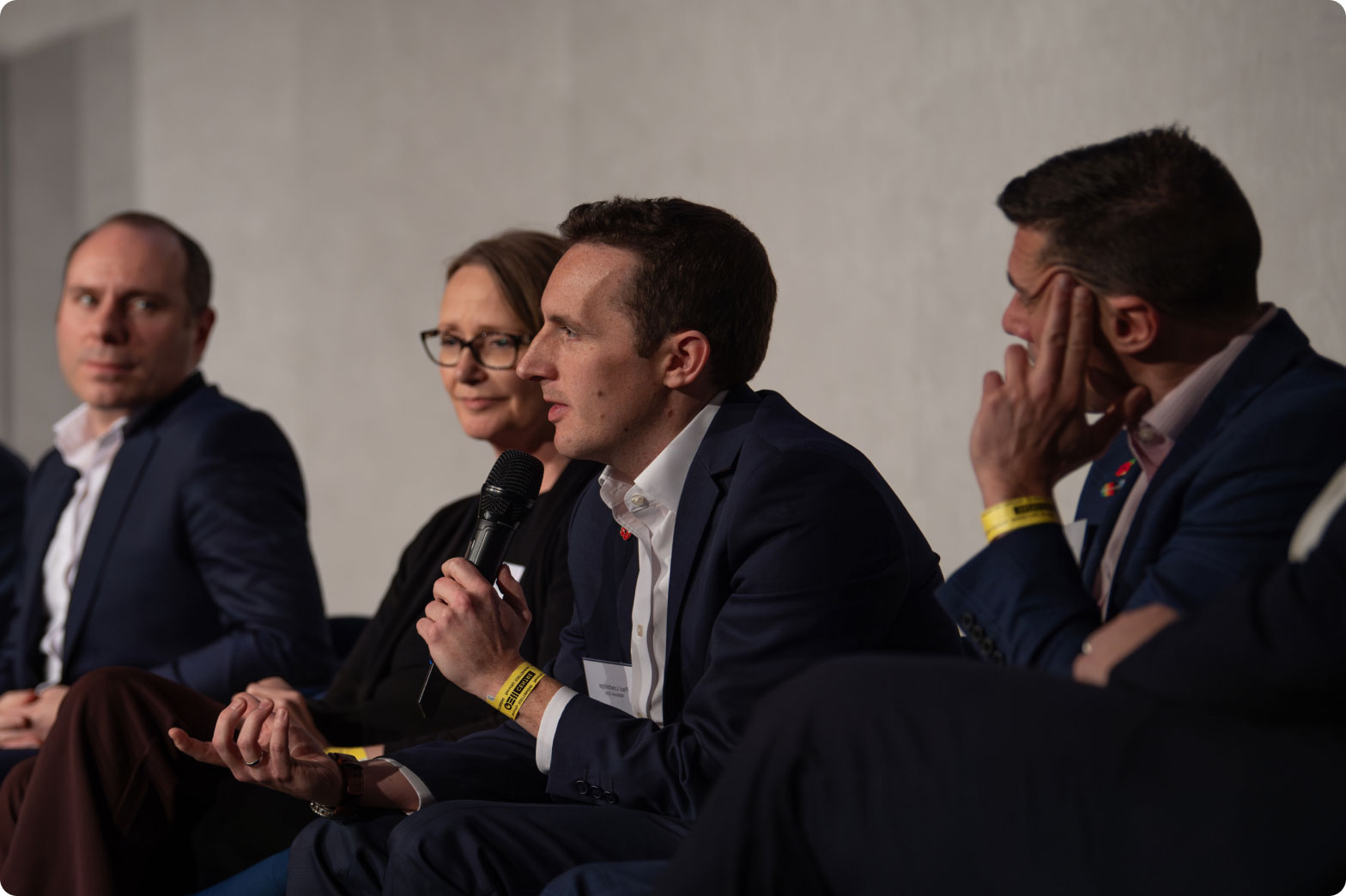 Panel at event engaging with stakeholders by answer questions