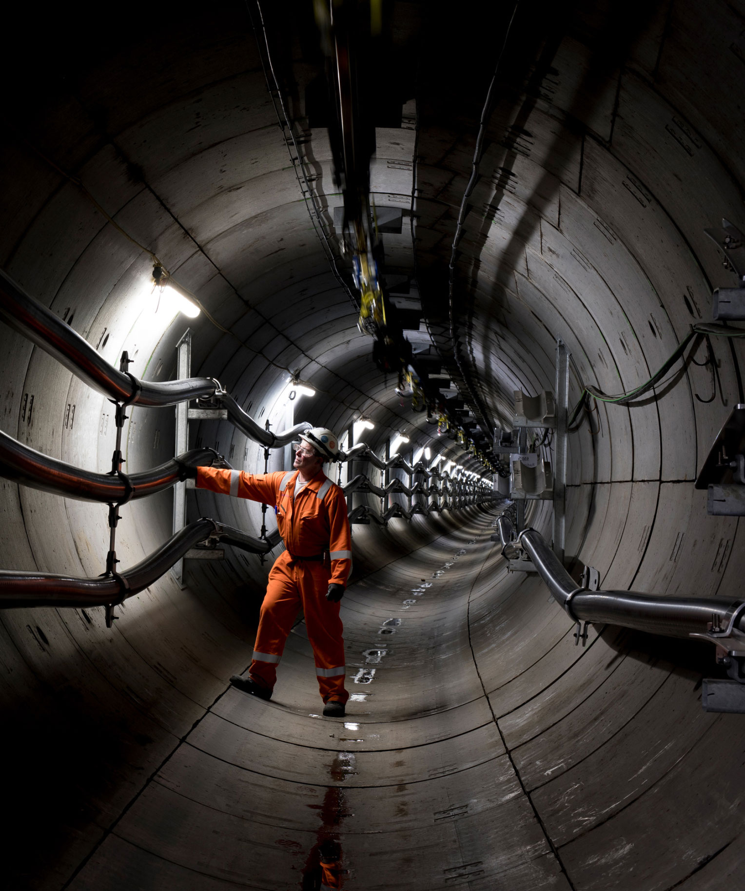 National Grid workers performing inspection in a power tunnel